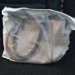 TAN/BROWN PURSE LOTS OF POCKETS AND COMPARTMENTS COMES WITH PROTECTER BAG NWOT